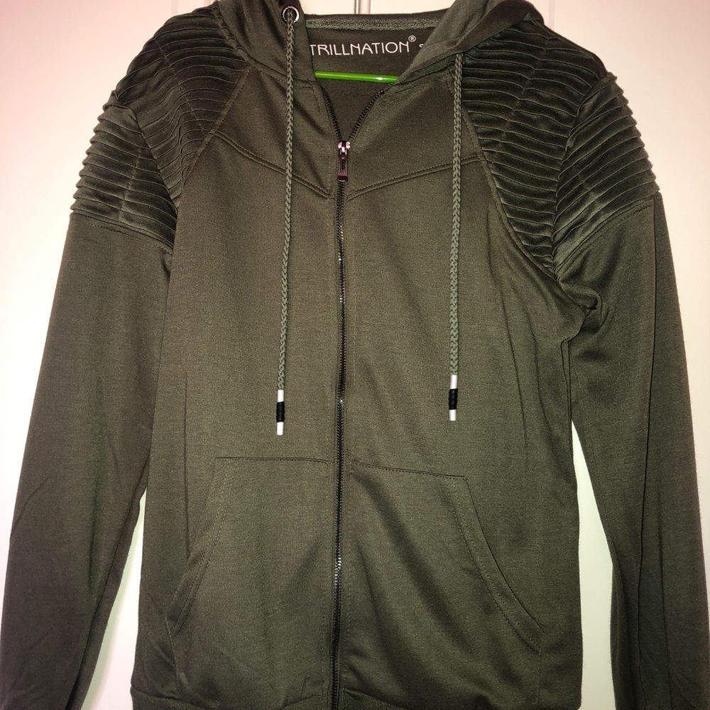 Green sweater.